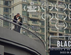 Sai (played by Xinwen Cui) and Thibaut Royer, the lead actors of 'The Black Box,' share a tender kiss with the bustling skyline of Shanghai in the background, capturing a poignant moment of connection amidst the vibrant cityscape.